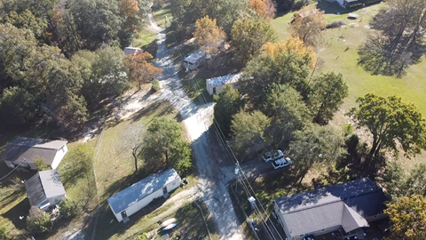 A residential area with houses and trees.