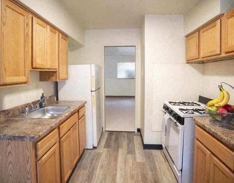 a kitchen with a stove and a sink