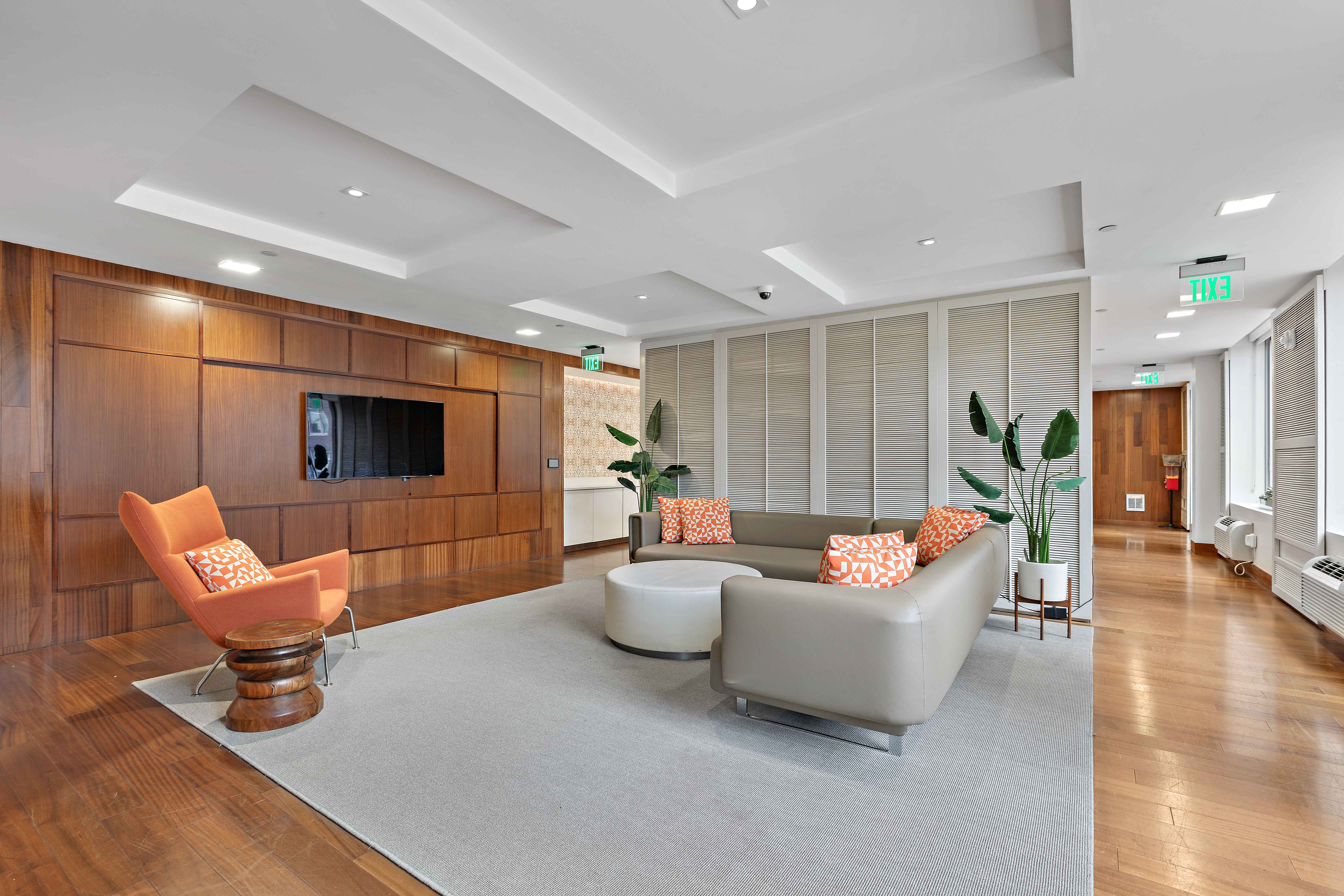 a living room with a couch and a tv