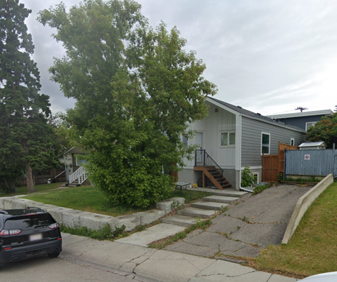 A car is parked on the side of a street.