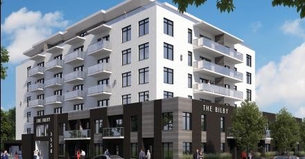 The Bilby is a modern apartment building with balconies on each floor.