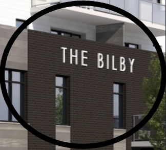 A brick building with a sign that says "The Bilby".