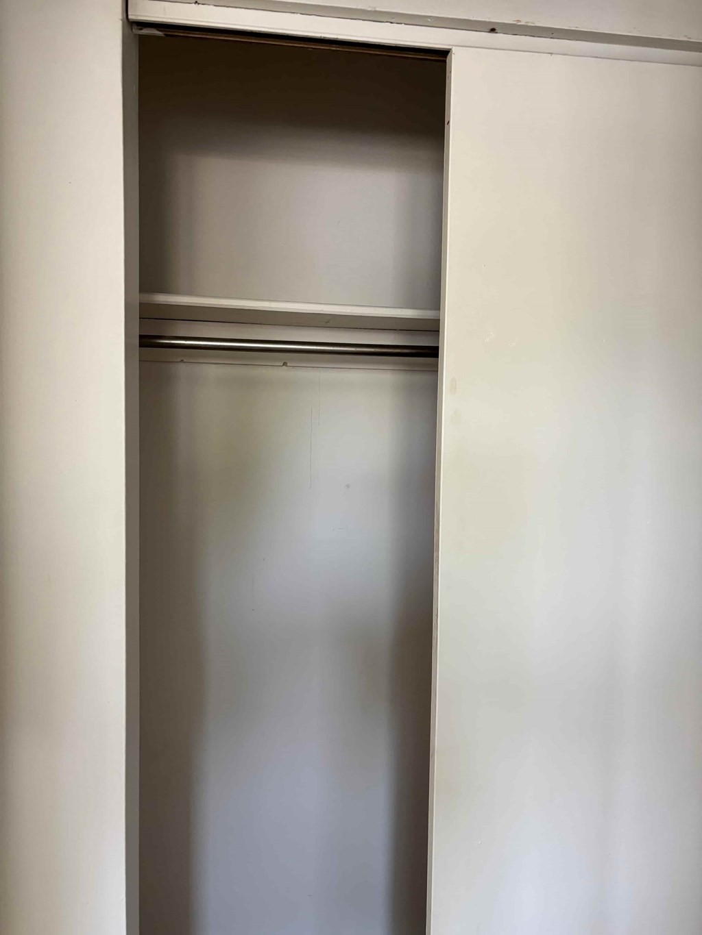 A white door is open.