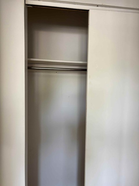 A white door is open.