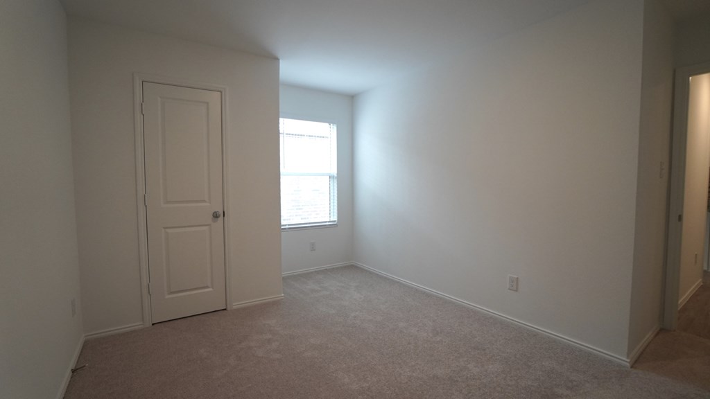 A room with a door and a window.