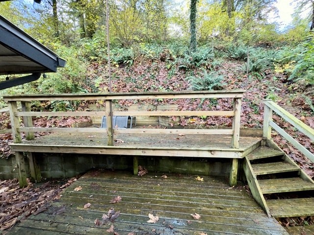 a wooden bridge in the middle of the woods