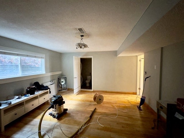 a living room is being remodeled with wood floors