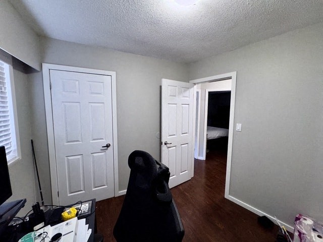 a room with two doors and a chair in it