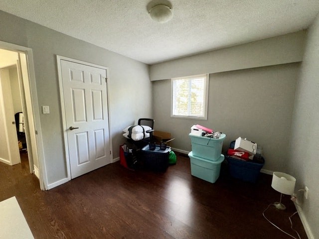 a living room with trash cans and a white door