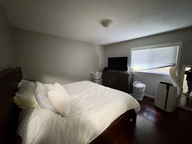 a bedroom with a bed and a tv in it