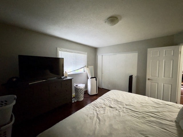 a bedroom with a bed and a tv in it