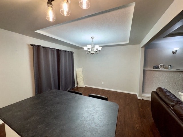 a dining room with a table and a chandelier