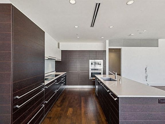 a kitchen with a counter top and a sink