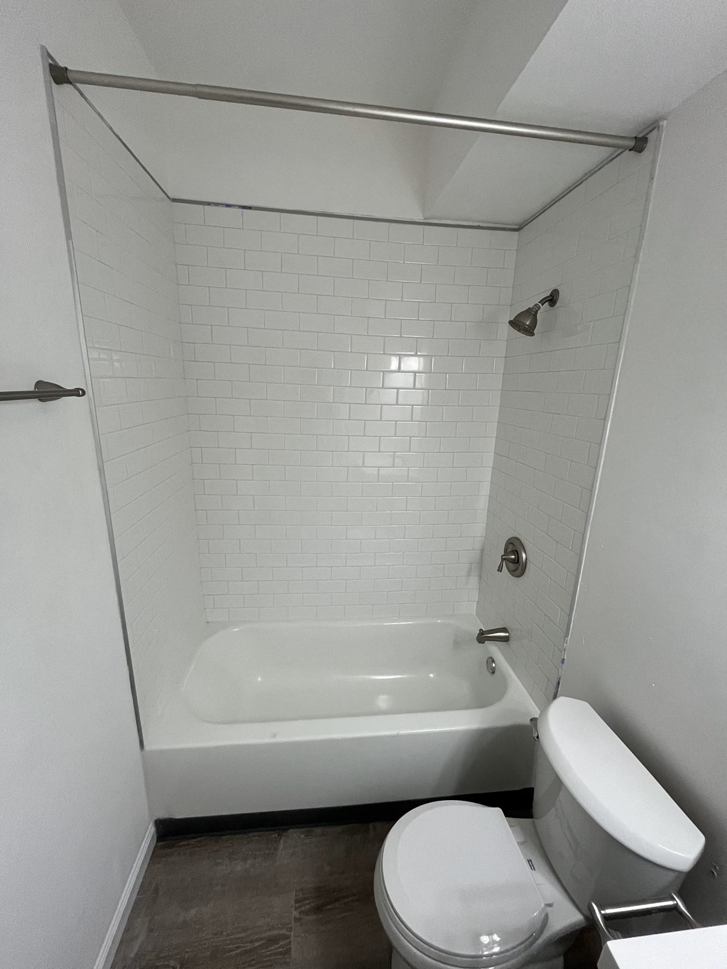a small bathroom with a toilet and a tub