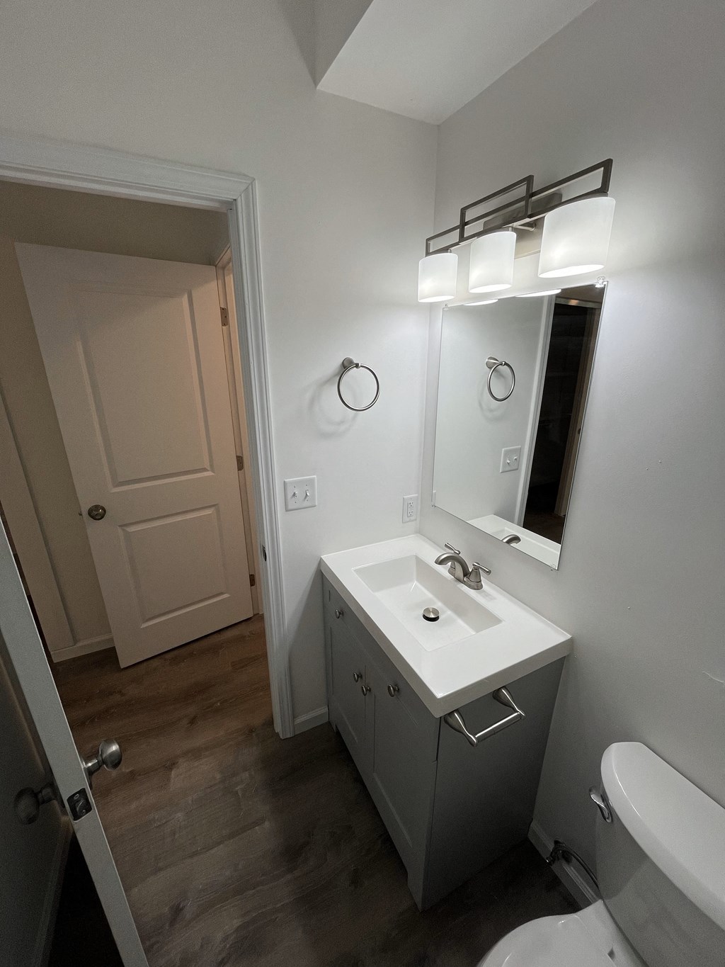 a small bathroom with a sink and a mirror