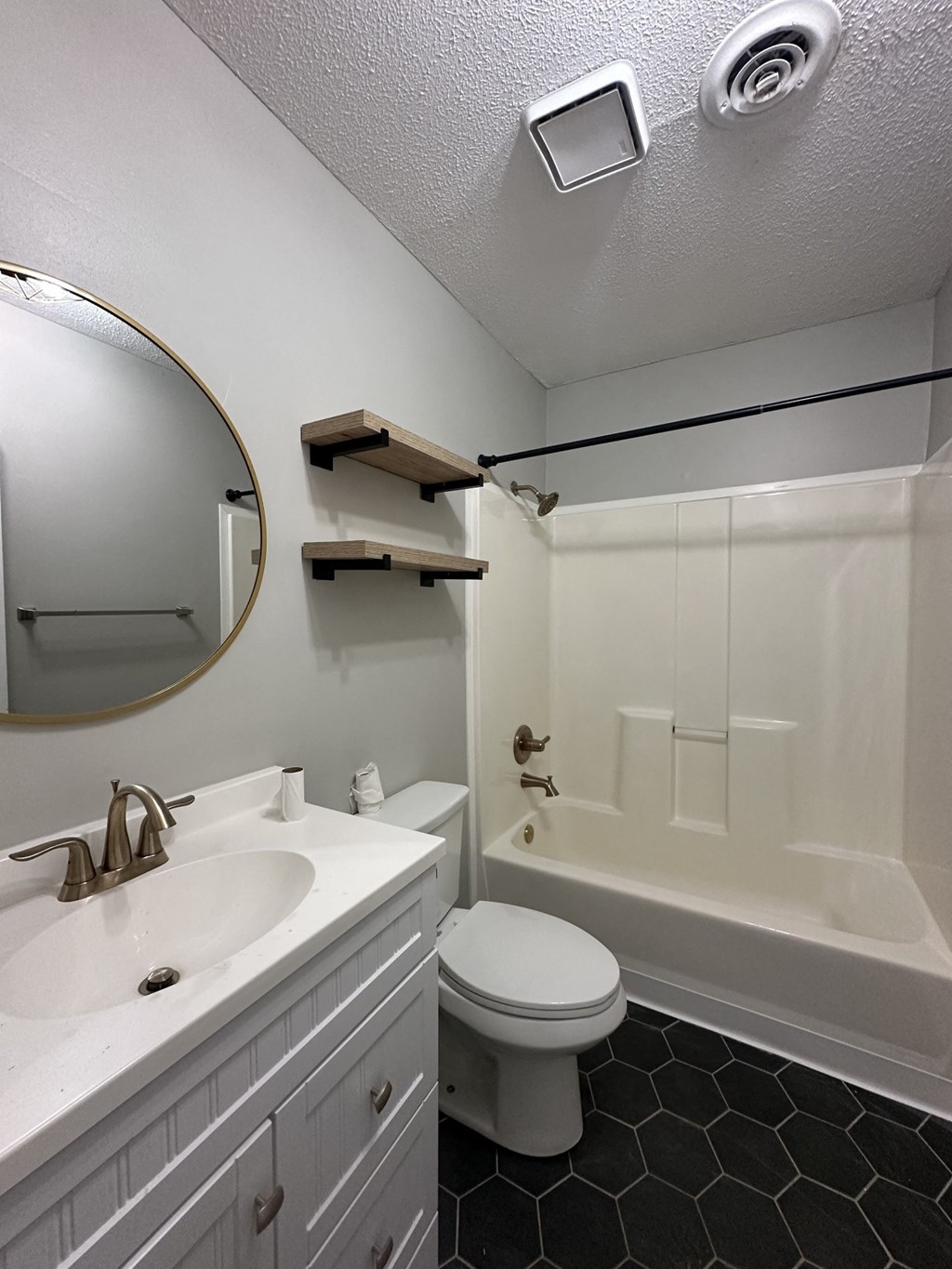 a bathroom with a sink toilet and a tub