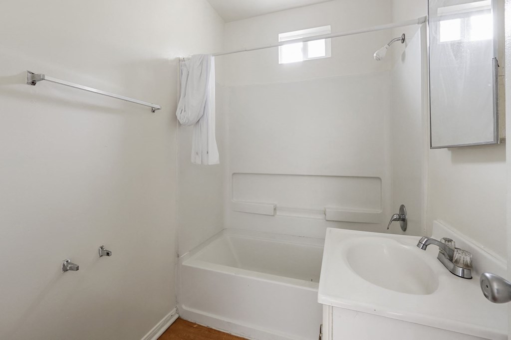 a bathroom with a sink and a bath tub