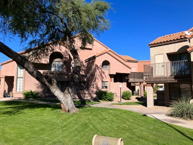 a large house with a tree in the yard