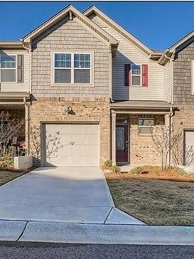 A house with a red door and a garage door.