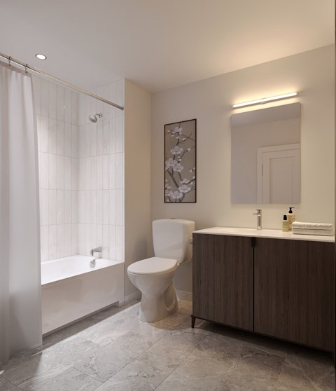 a bathroom with a toilet and a tub and a sink
