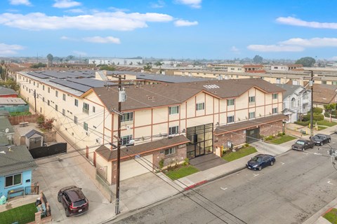 Apartment complex with a blue building to the left.