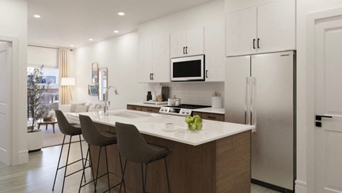 a kitchen with a large island with three stools
