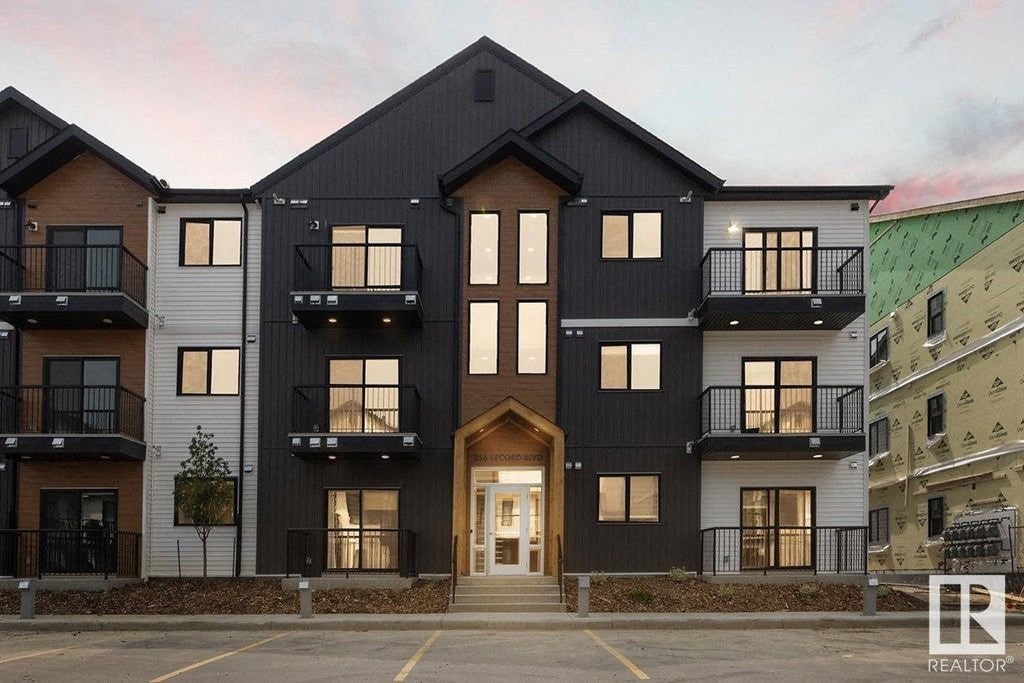 the exterior of a building with black and white buildings