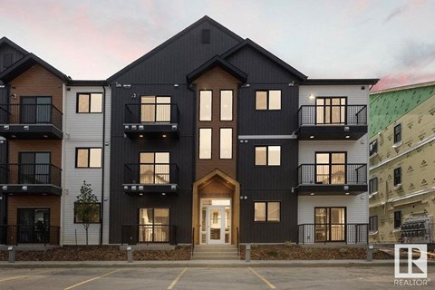 the exterior of a building with black and white buildings