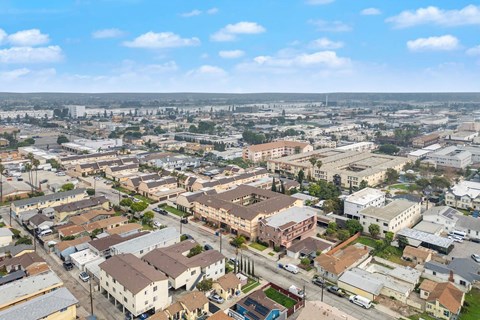 A bird's eye view of a residential area with houses and buildings.