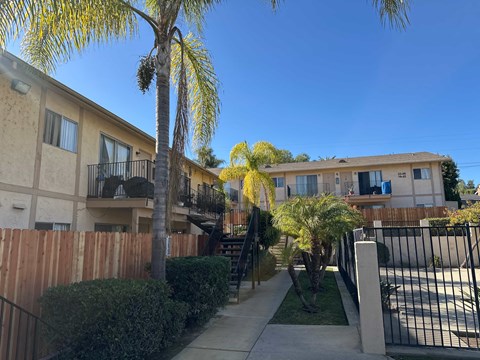 A sunny day in a residential area with a clear blue sky.