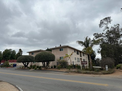 A house with a tree in front of it.