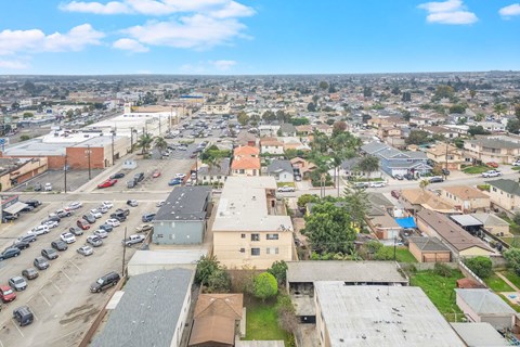 A cityscape with buildings and cars.
