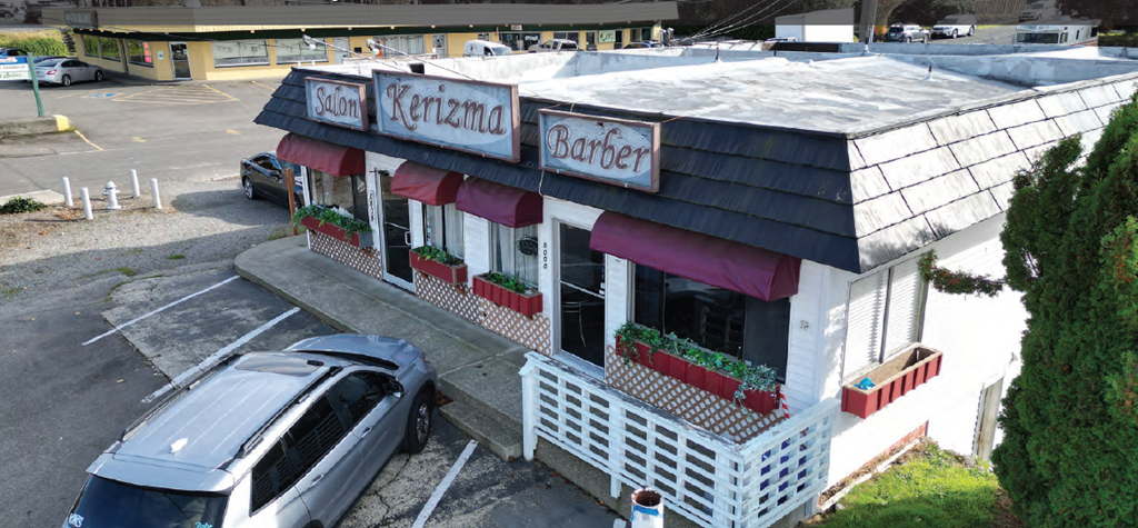 an aerial view of a restaurant with a car parked outside