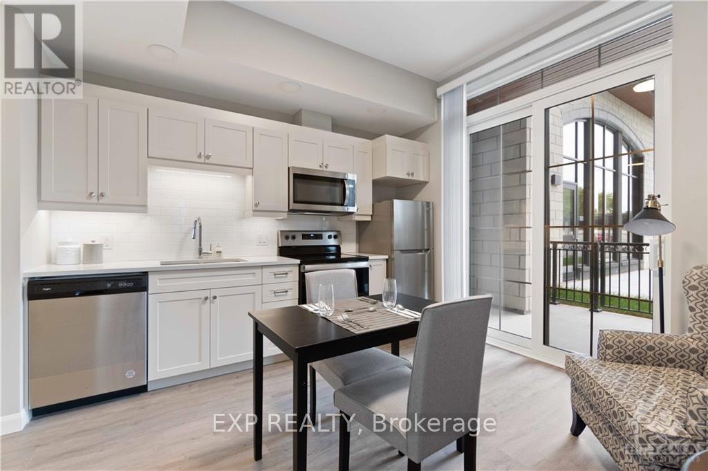 A modern kitchen with a dining table and chairs.