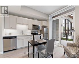 A modern kitchen with a dining table and chairs.