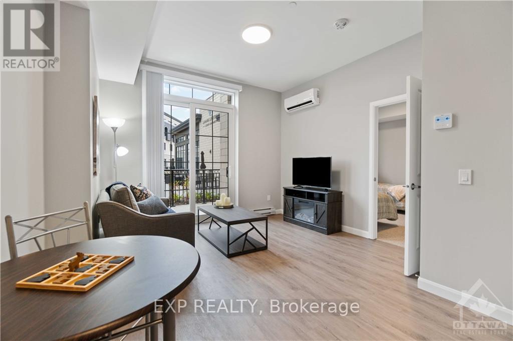 A living room with a dining table and chairs.