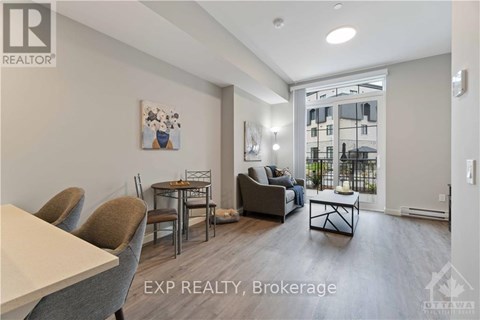 A living room with a dining table and chairs.