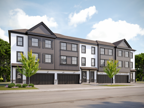 A modern two-story apartment building with a mix of white and dark grey exterior.