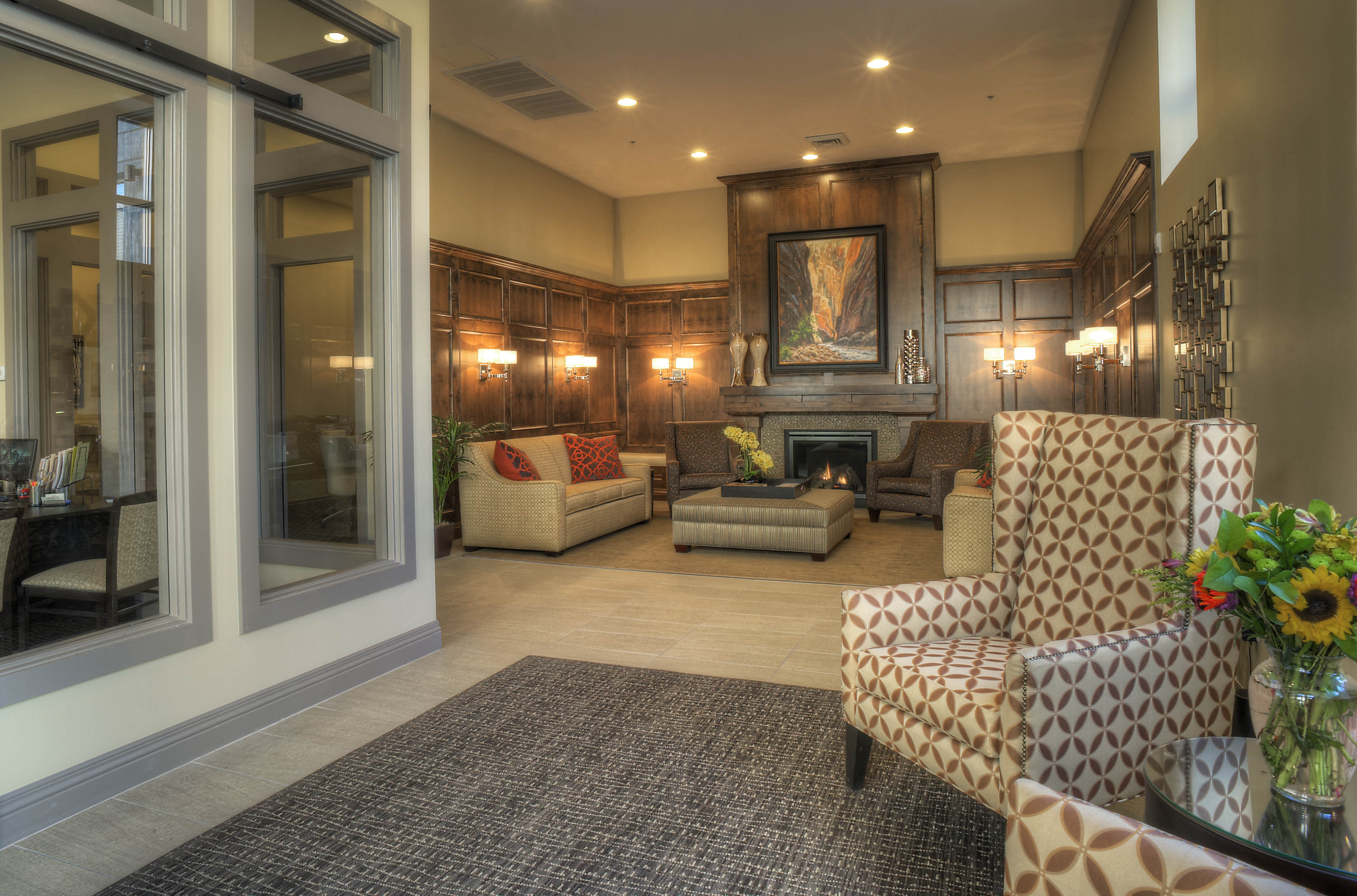 a large living room with furniture and a fireplace