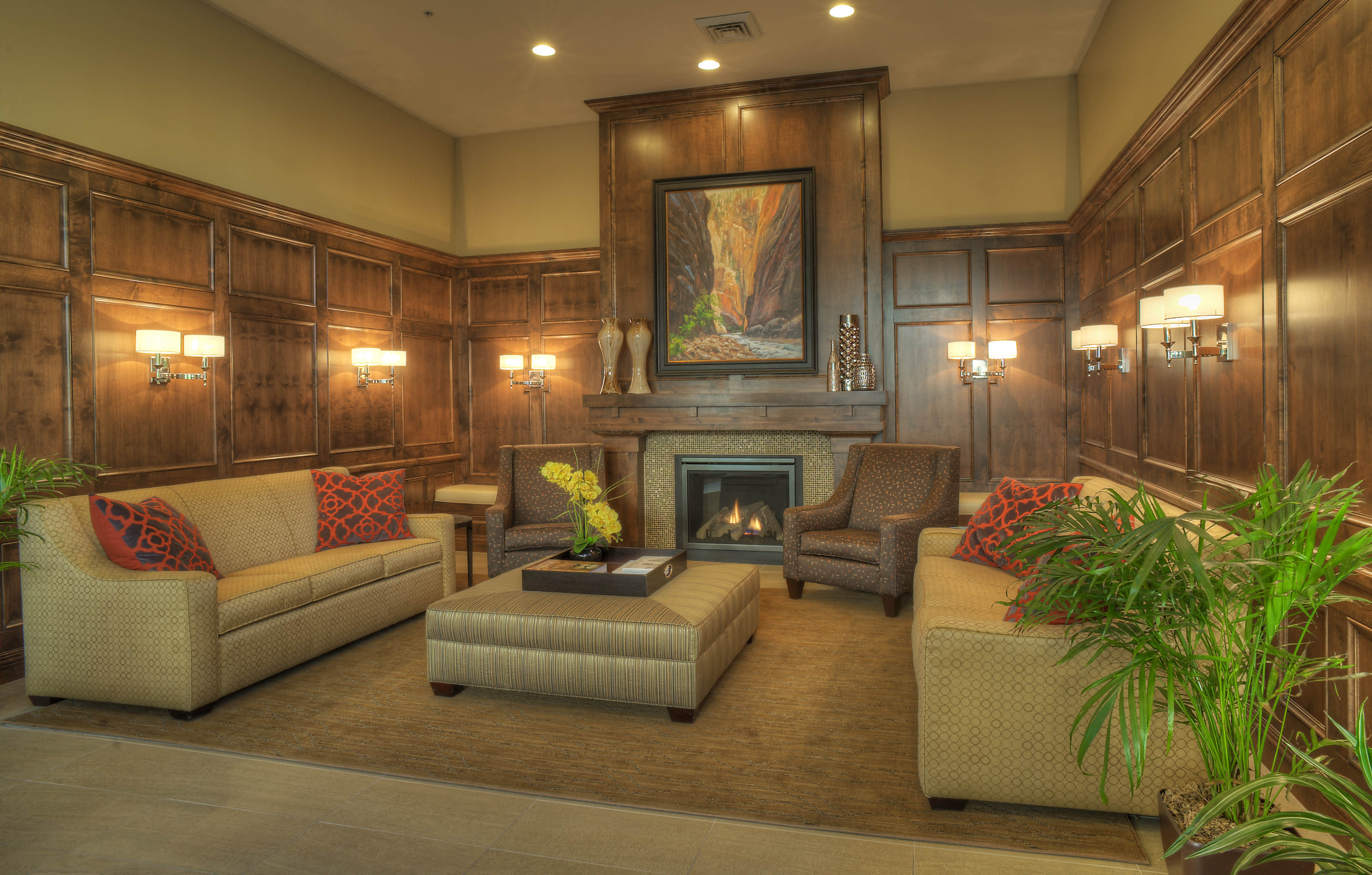 a living room with furniture and a fireplace