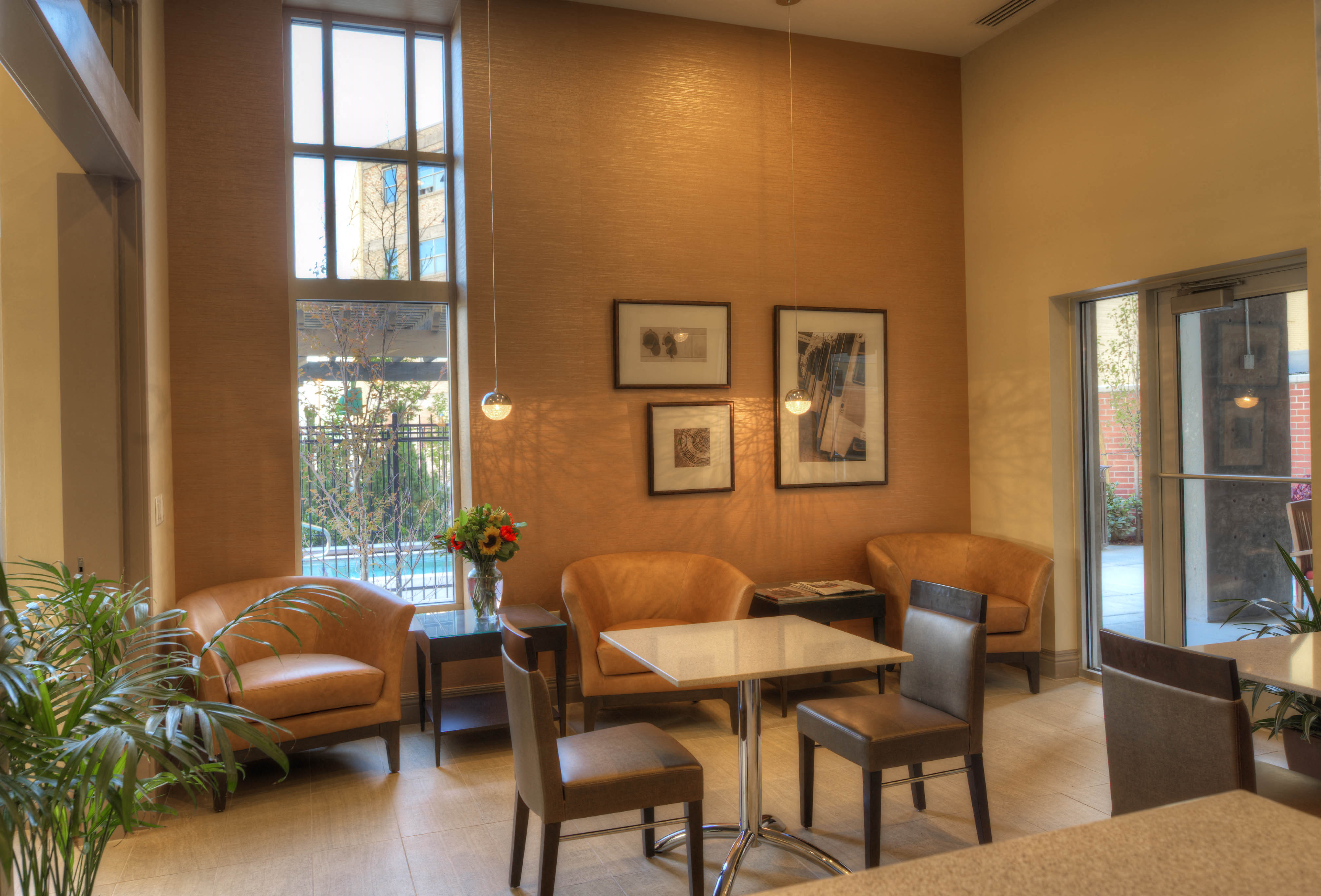 a living room with a table and chairs