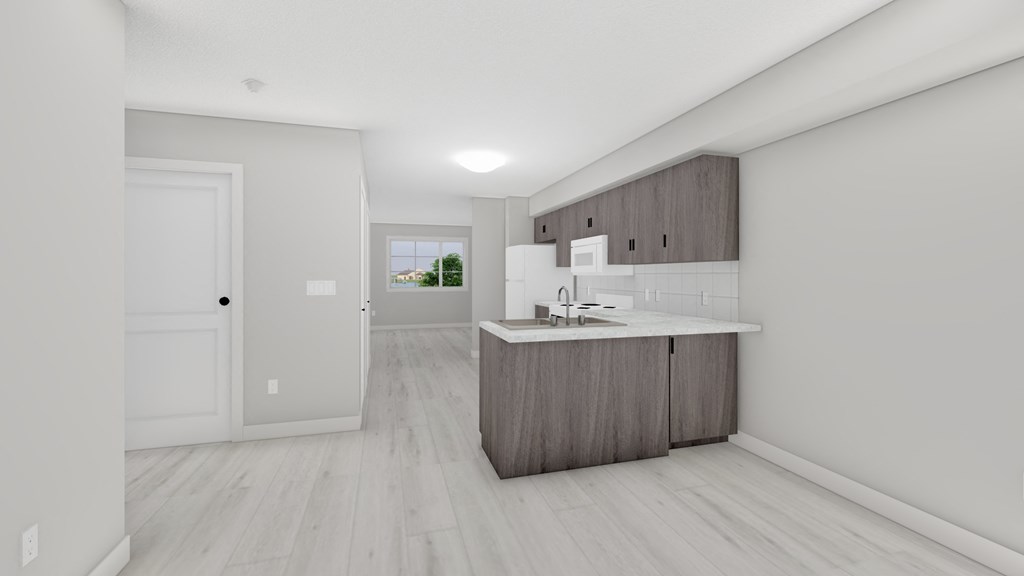 A modern kitchen with a white door and a window.