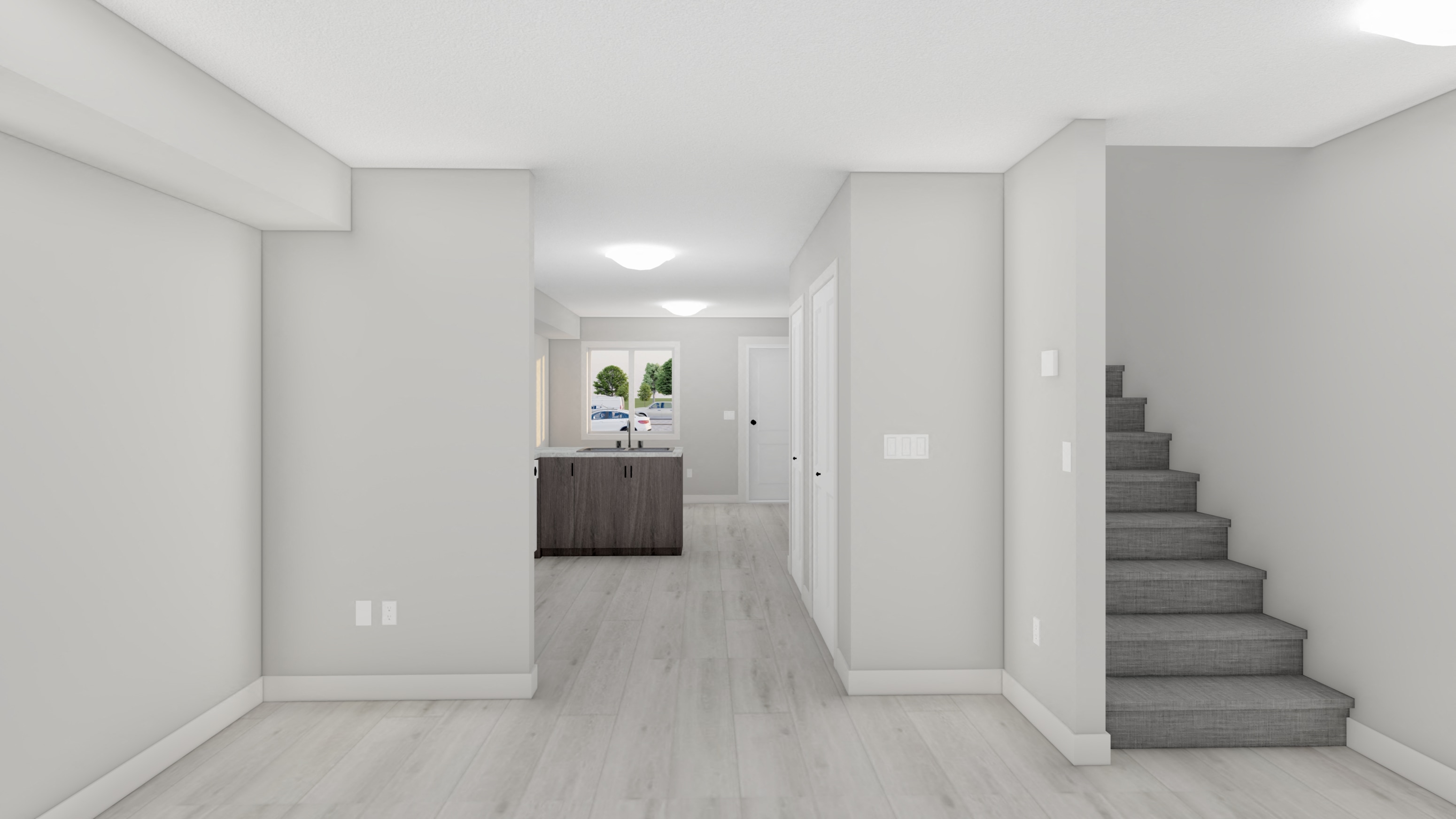 A spacious hallway with a staircase leading to the second floor.