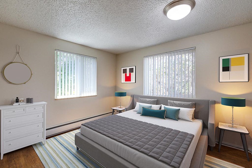 a bedroom with a bed and two windows