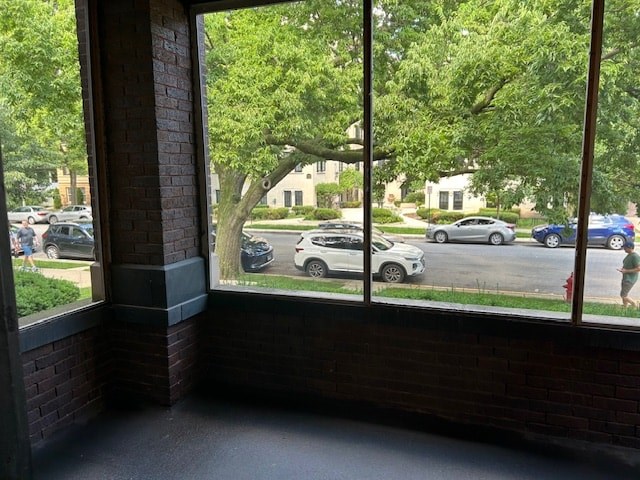 A view of a parking lot through a window.