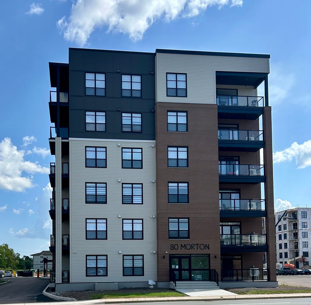 The building is called 80 Morton and is a multi-story residential building.
