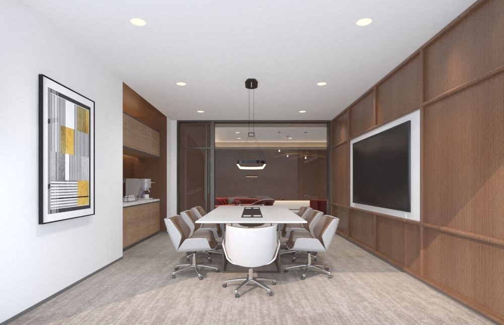 A conference room with a long table and chairs.