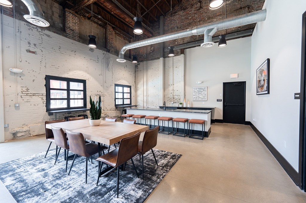 A modern two-story house with a balcony and a garage door.