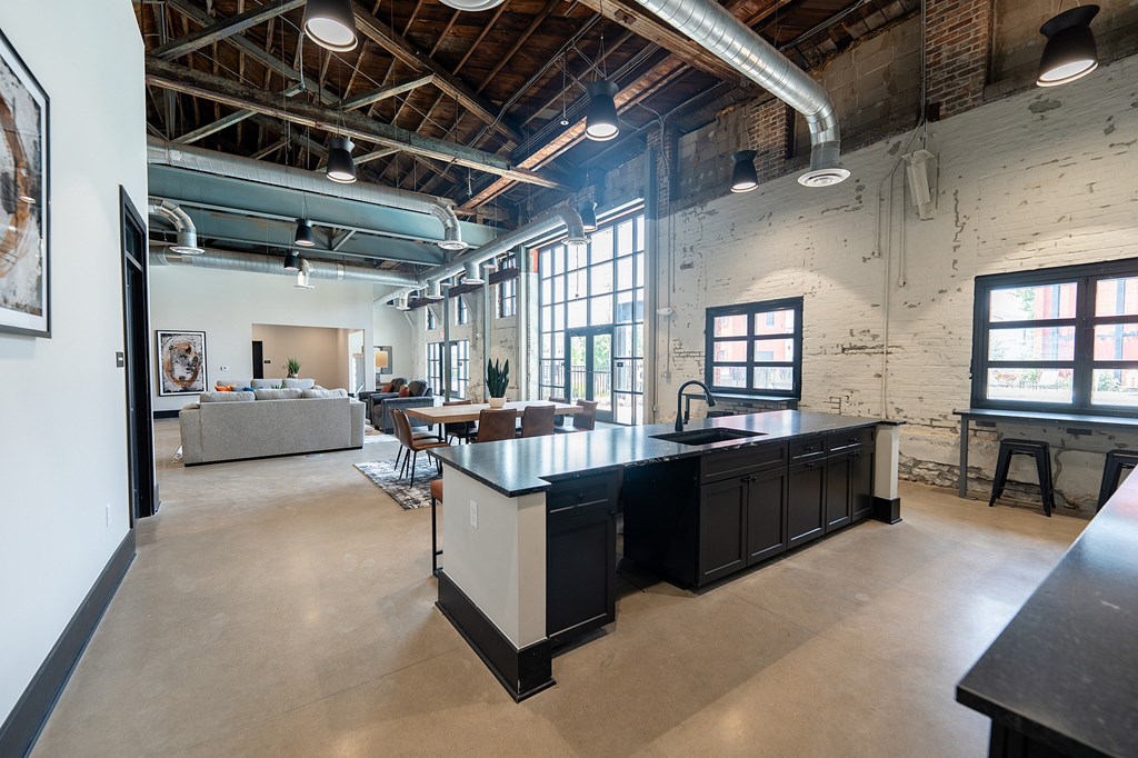 A kitchen with a large island in the middle of the room.