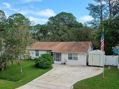 A house with a flag on a pole in front of it.